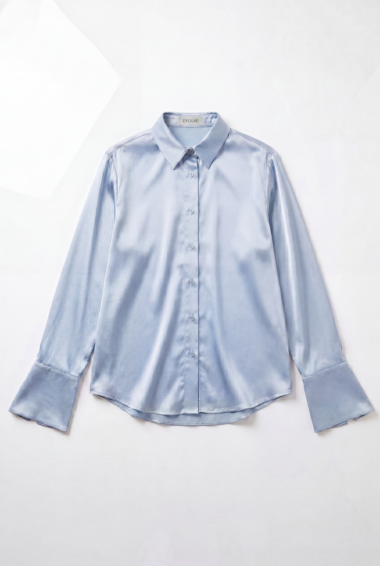 Light blue satin button-down shirt with long sleeves and oversized cuffs on a white background, flat lay.