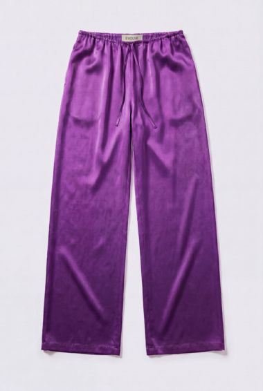 Purple satin wide-leg pants with a drawstring waist, EVOLVE label at the back of the waistband, laid flat on a white background.